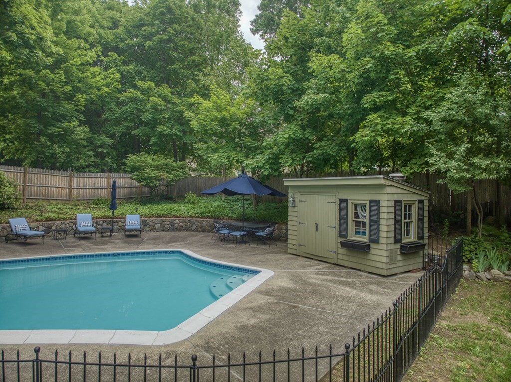 11 Avalon Road Reading, MA 01867 - Photo 7 of 31 a view of a house with a backyard and a patio