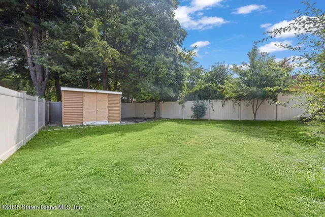 an aerial view of a house with a garden