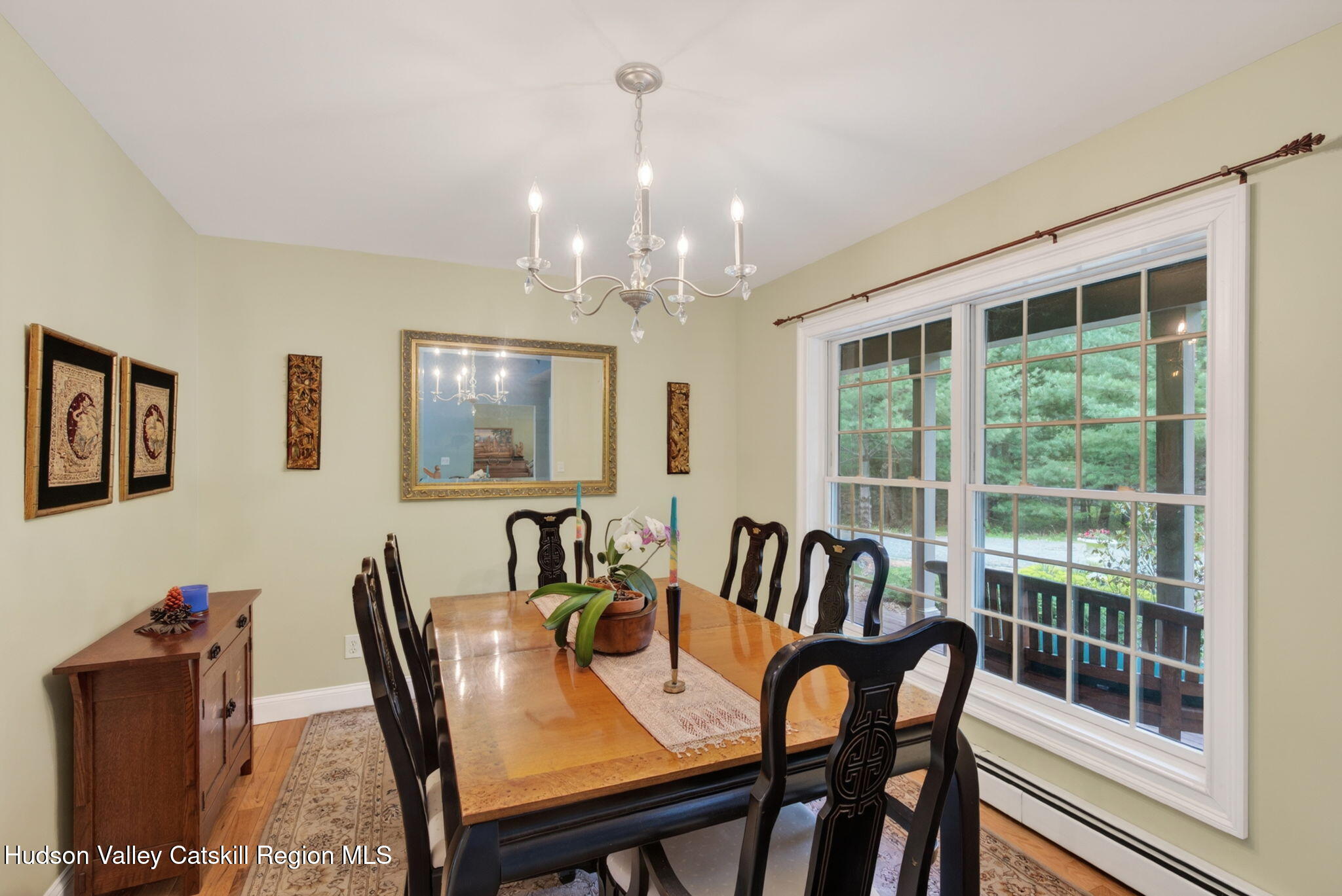 189 Bush Road Stone Ridge, NY 12484 - Photo 18 of 60 a view of a dining room with furniture large windows and wooden floor