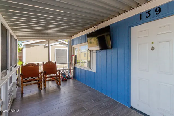 a view of dining room with furniture window and wooden floor