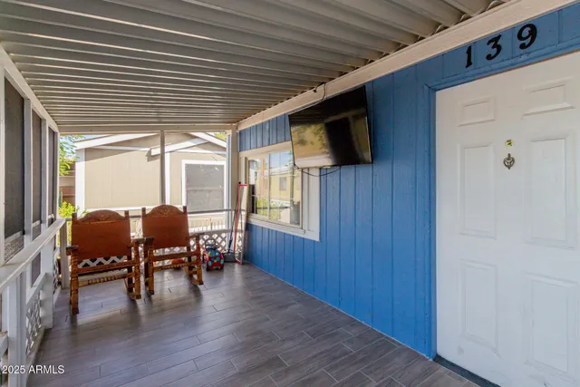 a view of dining room with furniture window and wooden floor