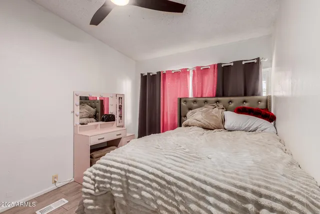 a bedroom with a bed and a closet