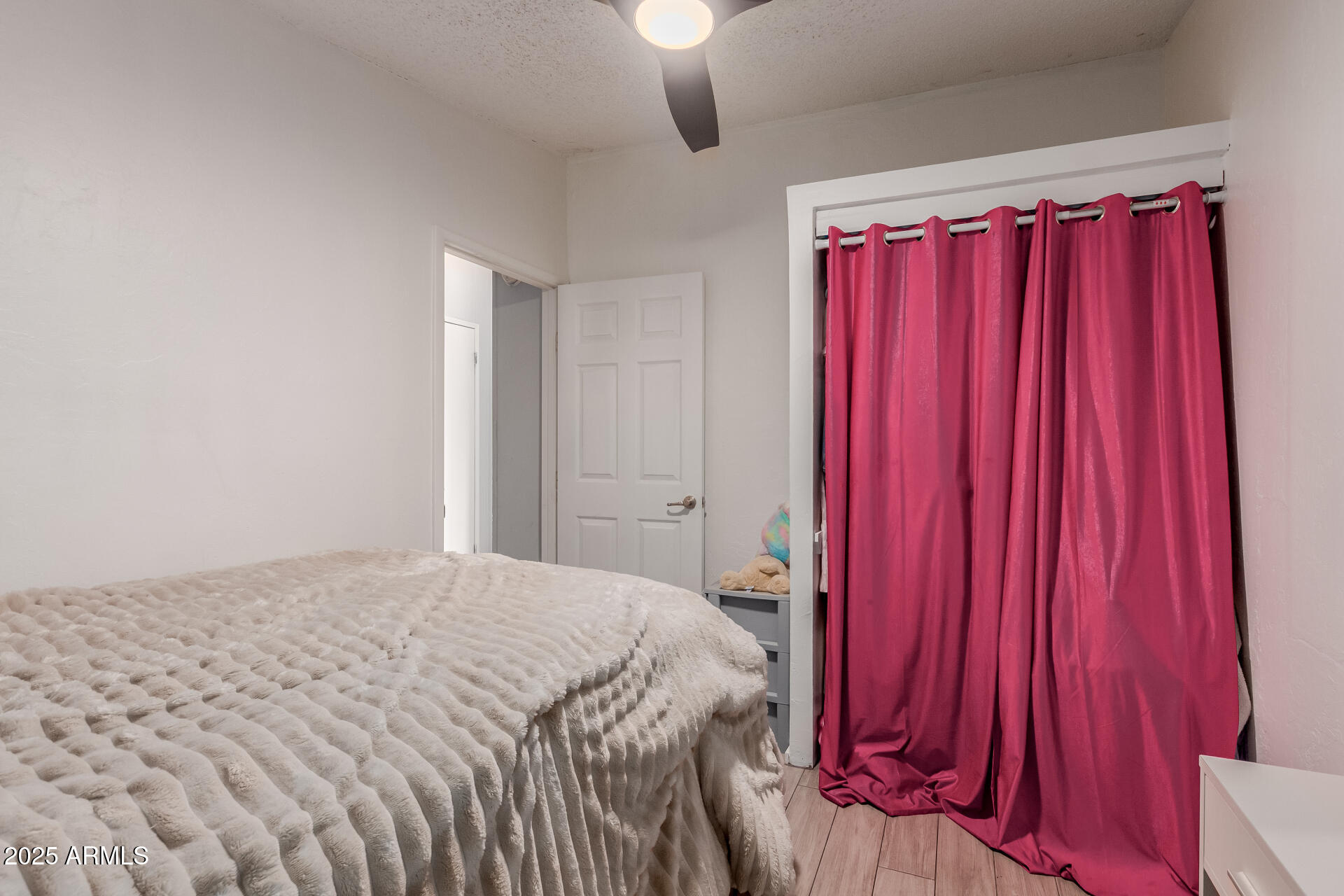 555 West Warner Road, Unit 139 Chandler, AZ 85225 - Photo 13 of 21 a bedroom with a bed and a chandelier