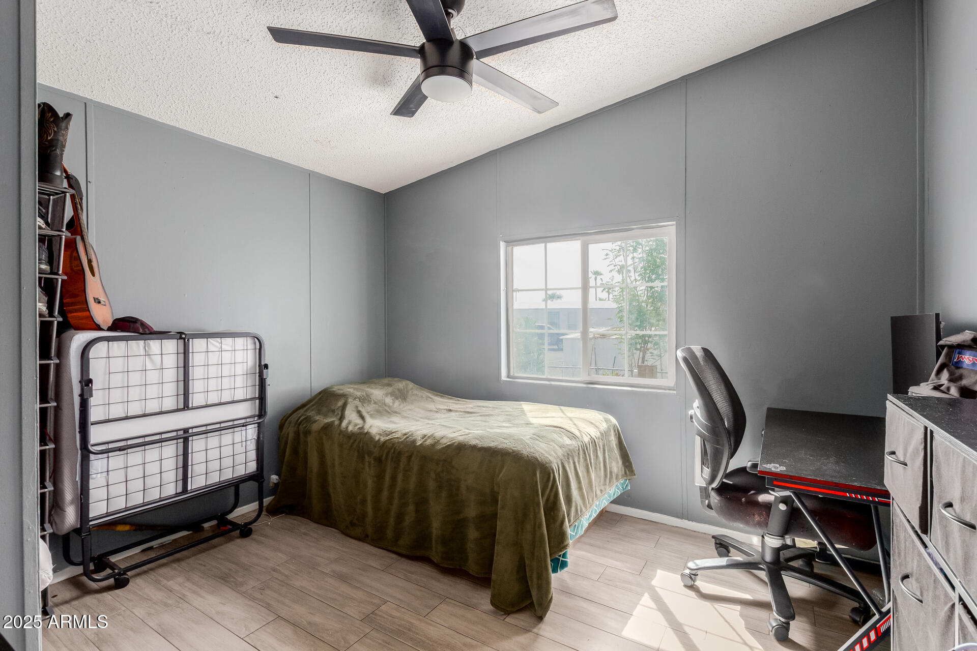 555 West Warner Road, Unit 139 Chandler, AZ 85225 - Photo 15 of 21 a bed sitting in a bedroom next to a window