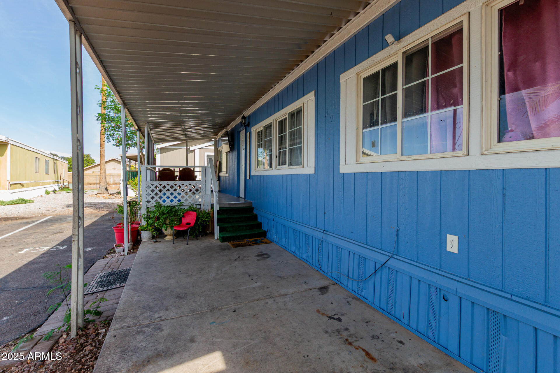 555 West Warner Road, Unit 139 Chandler, AZ 85225 - Photo 2 of 21 a view of a house with a porch