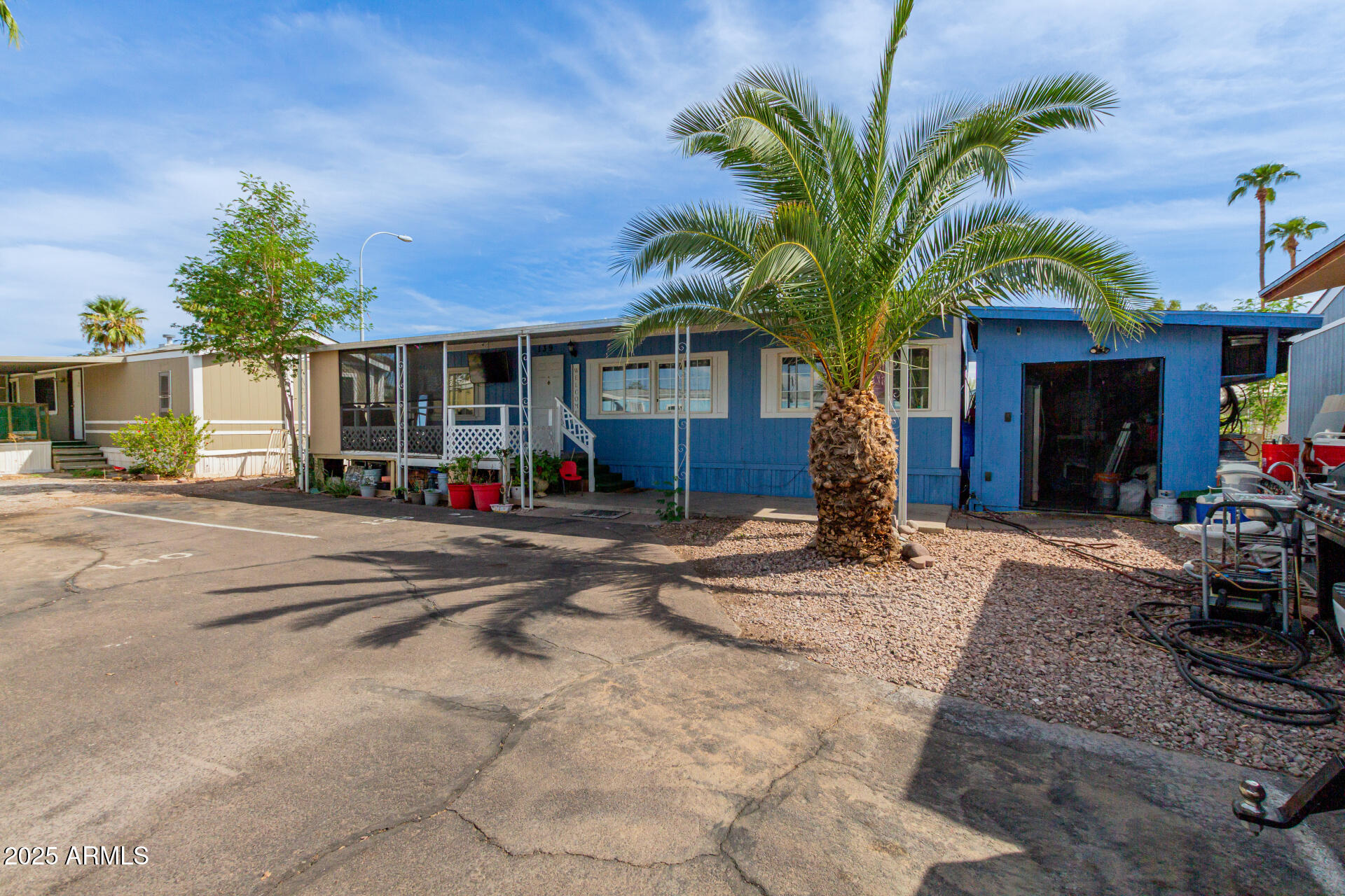 555 West Warner Road, Unit 139 Chandler, AZ 85225 - Photo 3 of 21 a front view of a house with a yard and garage