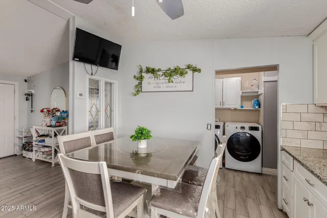 a view of a dining room with furniture and wooden floor