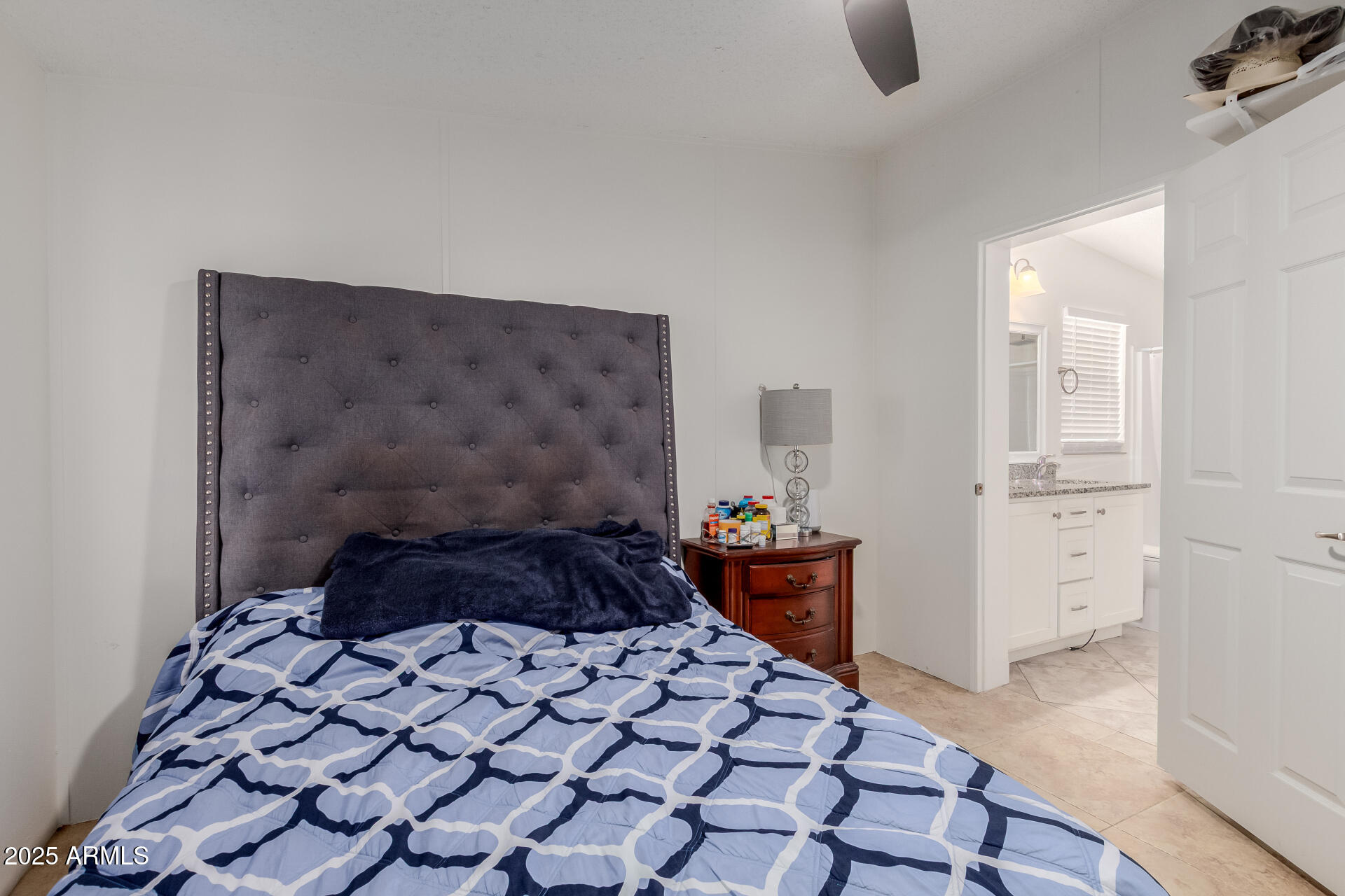 555 West Warner Road, Unit 139 Chandler, AZ 85225 - Photo 9 of 21 a bedroom with a bed and a cabinets