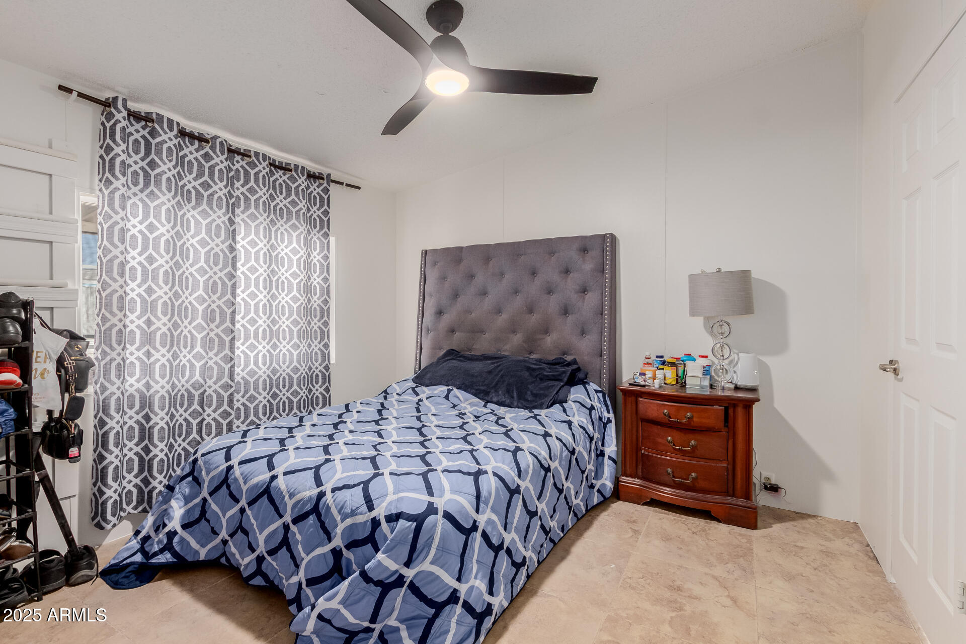 555 West Warner Road, Unit 139 Chandler, AZ 85225 - Photo 10 of 21 a bedroom with a bed and a chandelier