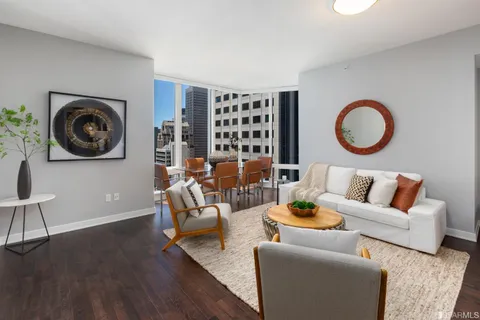 a dining room with furniture and wooden floor