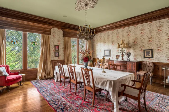 a bathroom with a granite countertop tub sink and mirror