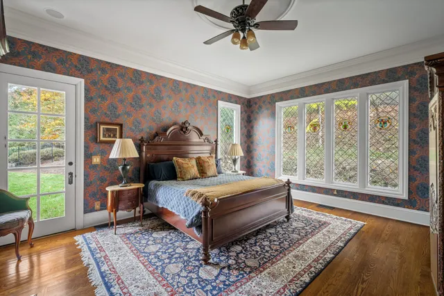 a view of a brick house with a yard