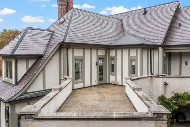 an aerial view of residential house with outdoor space and swimming pool