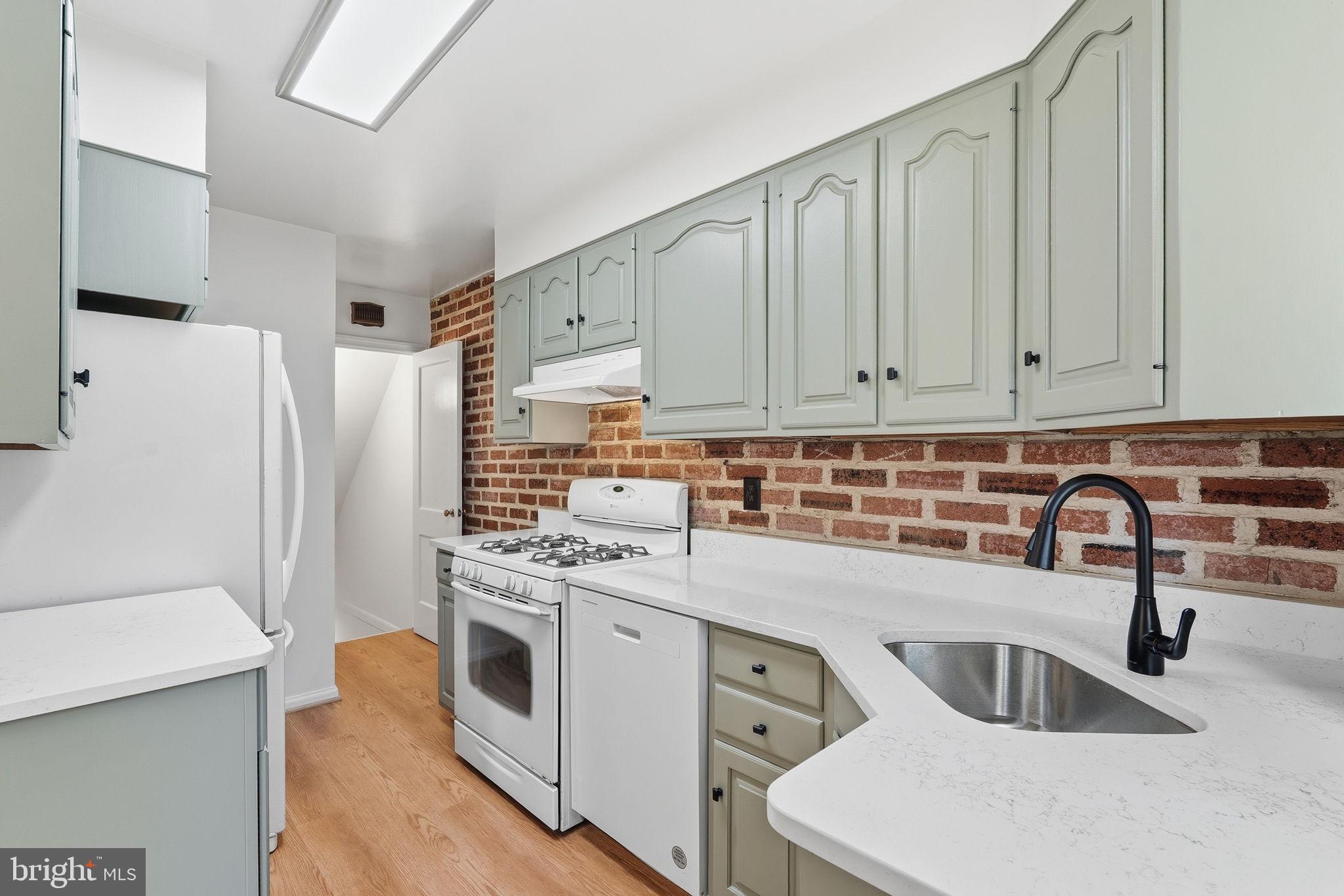 11977 Andrew Street Silver Spring, MD 20902 - Photo 12 of 28 Newly refreshed kitchen with quartz countertops
