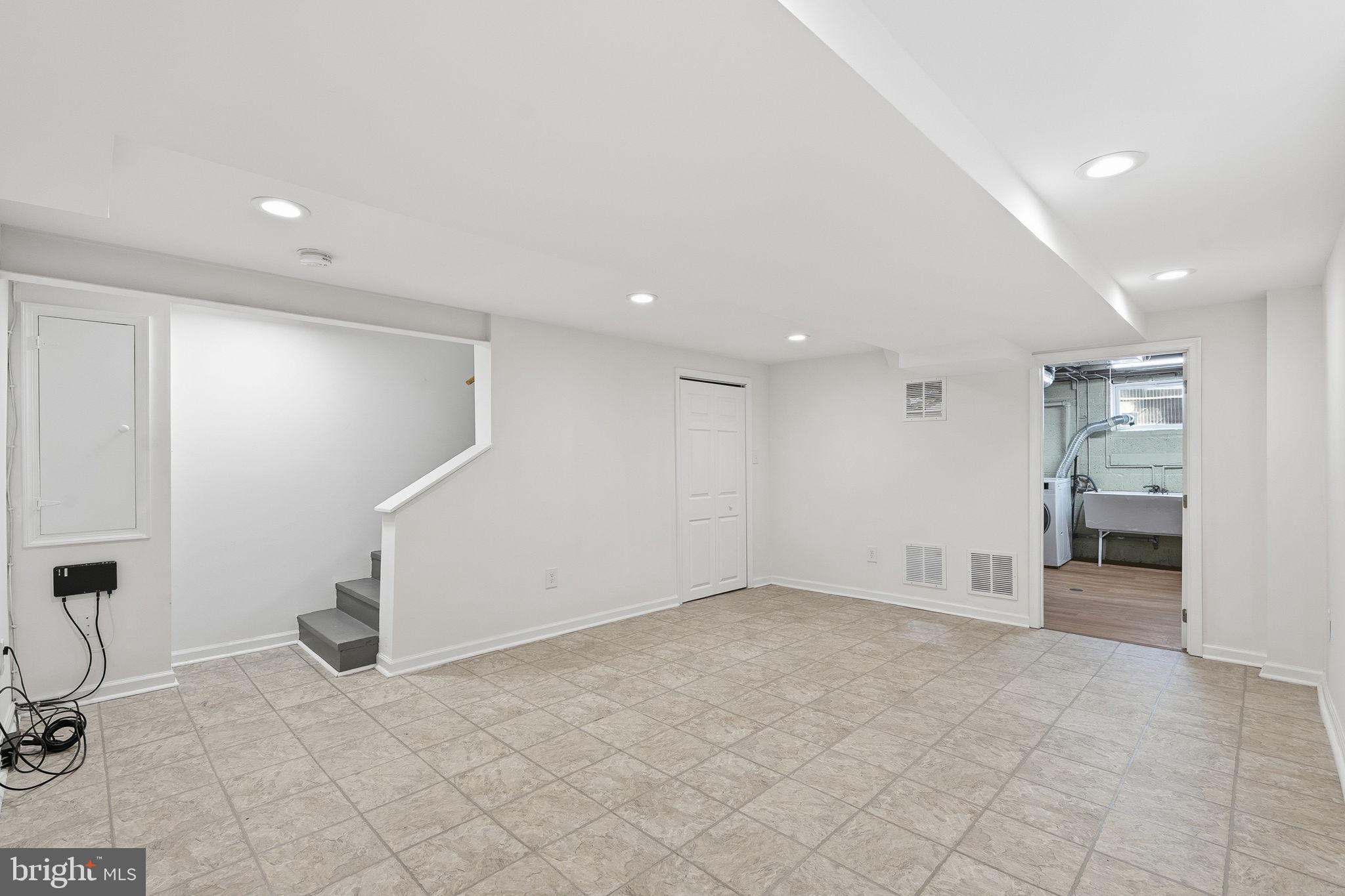 11977 Andrew Street Silver Spring, MD 20902 - Photo 24 of 28 Basement rec room perfect for a hobby space