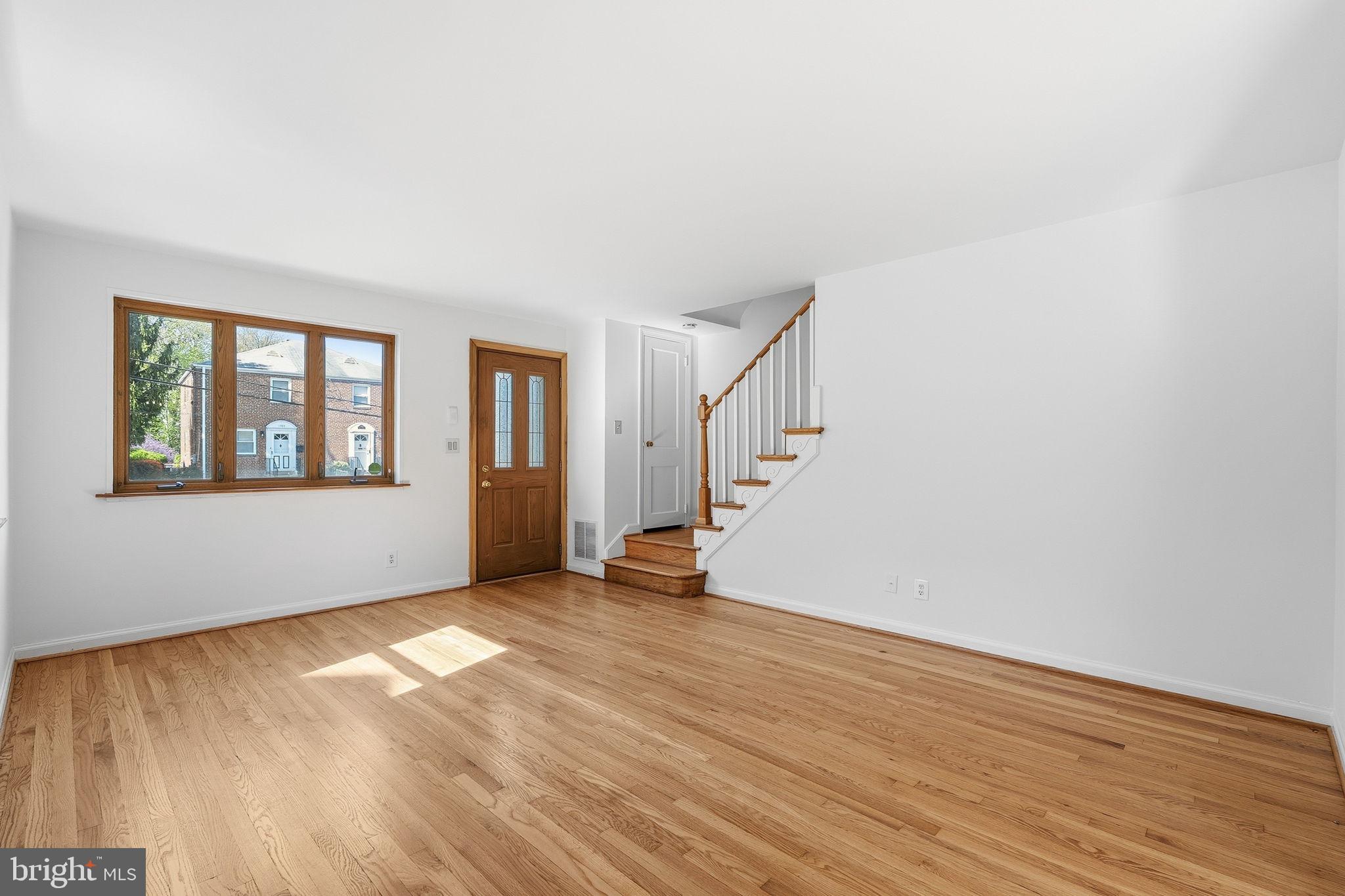 11977 Andrew Street Silver Spring, MD 20902 - Photo 5 of 28 Living room is bright and airy