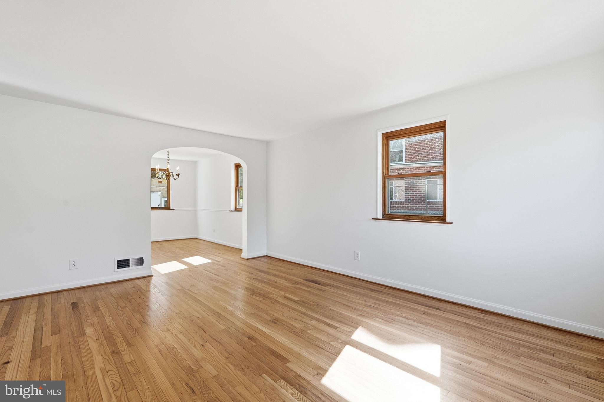 11977 Andrew Street Silver Spring, MD 20902 - Photo 6 of 28 Living room flows into dining roon