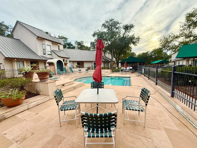 a view of a room with an empty space and balcony