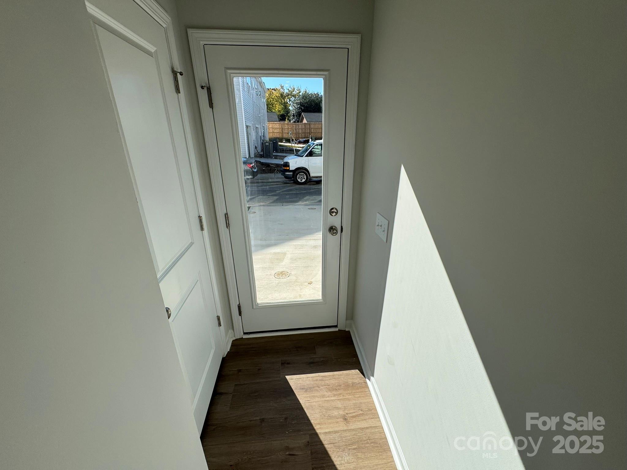 4720 Lakeview Road, Unit 12 Charlotte, NC 28216 - Photo 14 of 41 a view of hallway with wooden floor and a bathroom