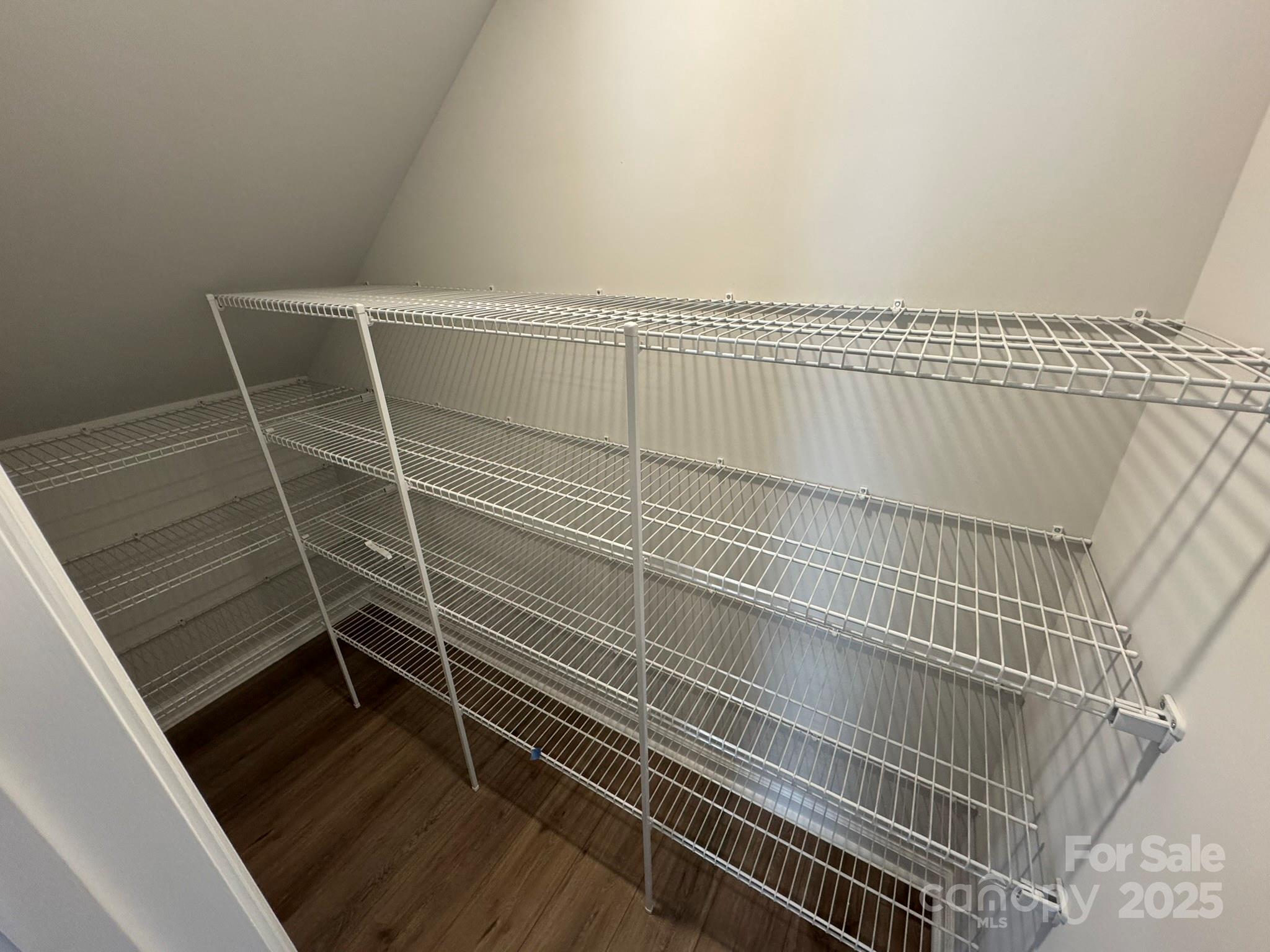 4720 Lakeview Road, Unit 12 Charlotte, NC 28216 - Photo 18 of 41 a view of a room with wooden floor and white walls
