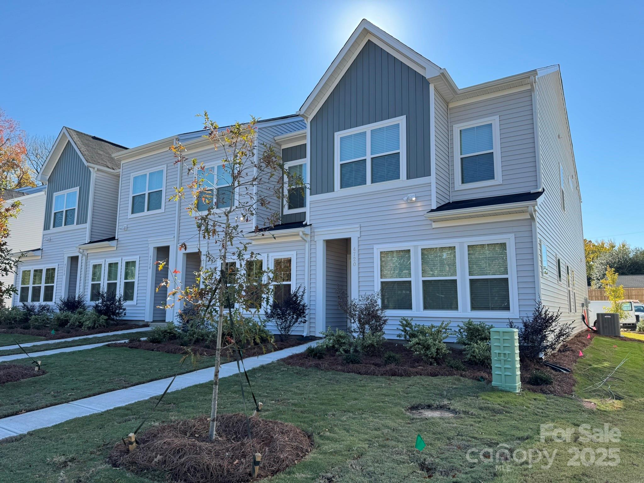 4720 Lakeview Road, Unit 12 Charlotte, NC 28216 - Photo 2 of 41 a front view of a house with garden