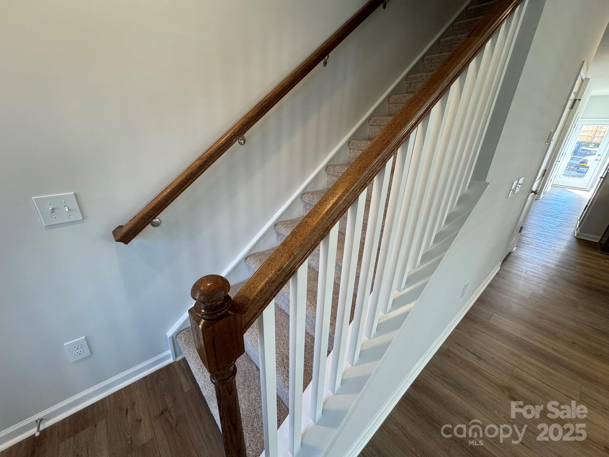 4720 Lakeview Road, Unit 12 Charlotte, NC 28216 - Photo 23 of 41 a view of staircase with railing and black white door