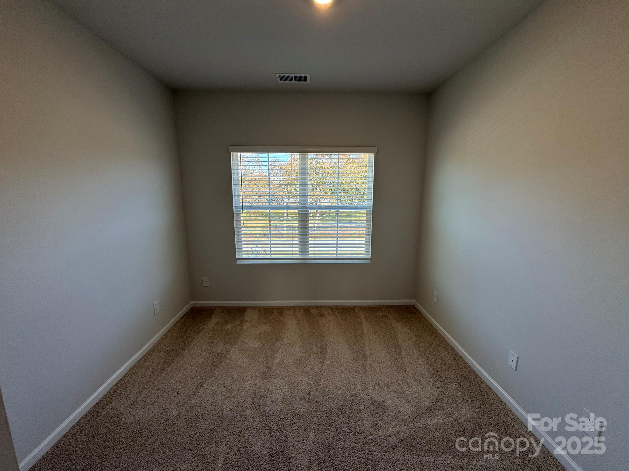 4720 Lakeview Road, Unit 12 Charlotte, NC 28216 - Photo 25 of 41 an empty room with a window