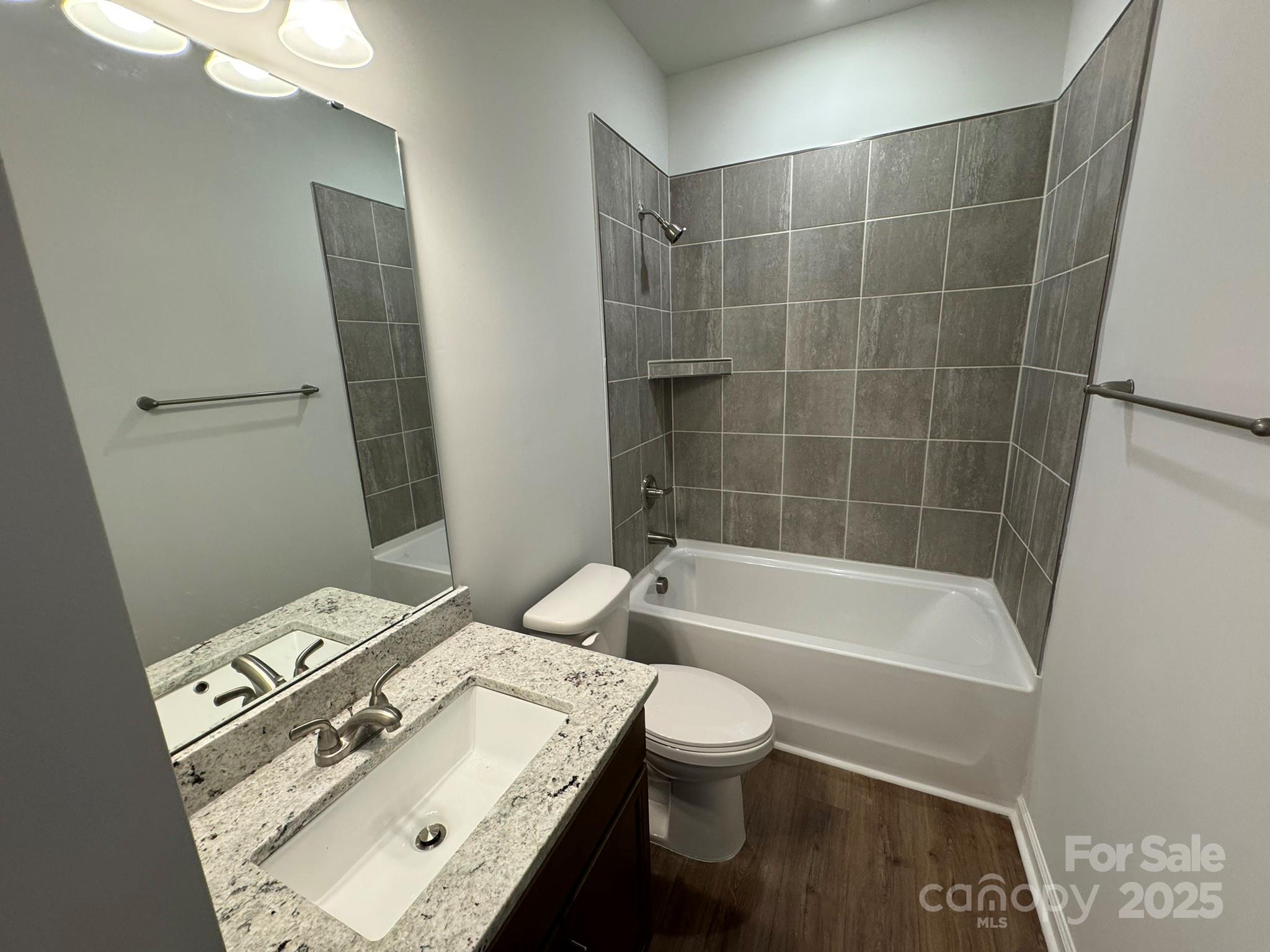 4720 Lakeview Road, Unit 12 Charlotte, NC 28216 - Photo 27 of 41 a bathroom with a sink toilet and shower
