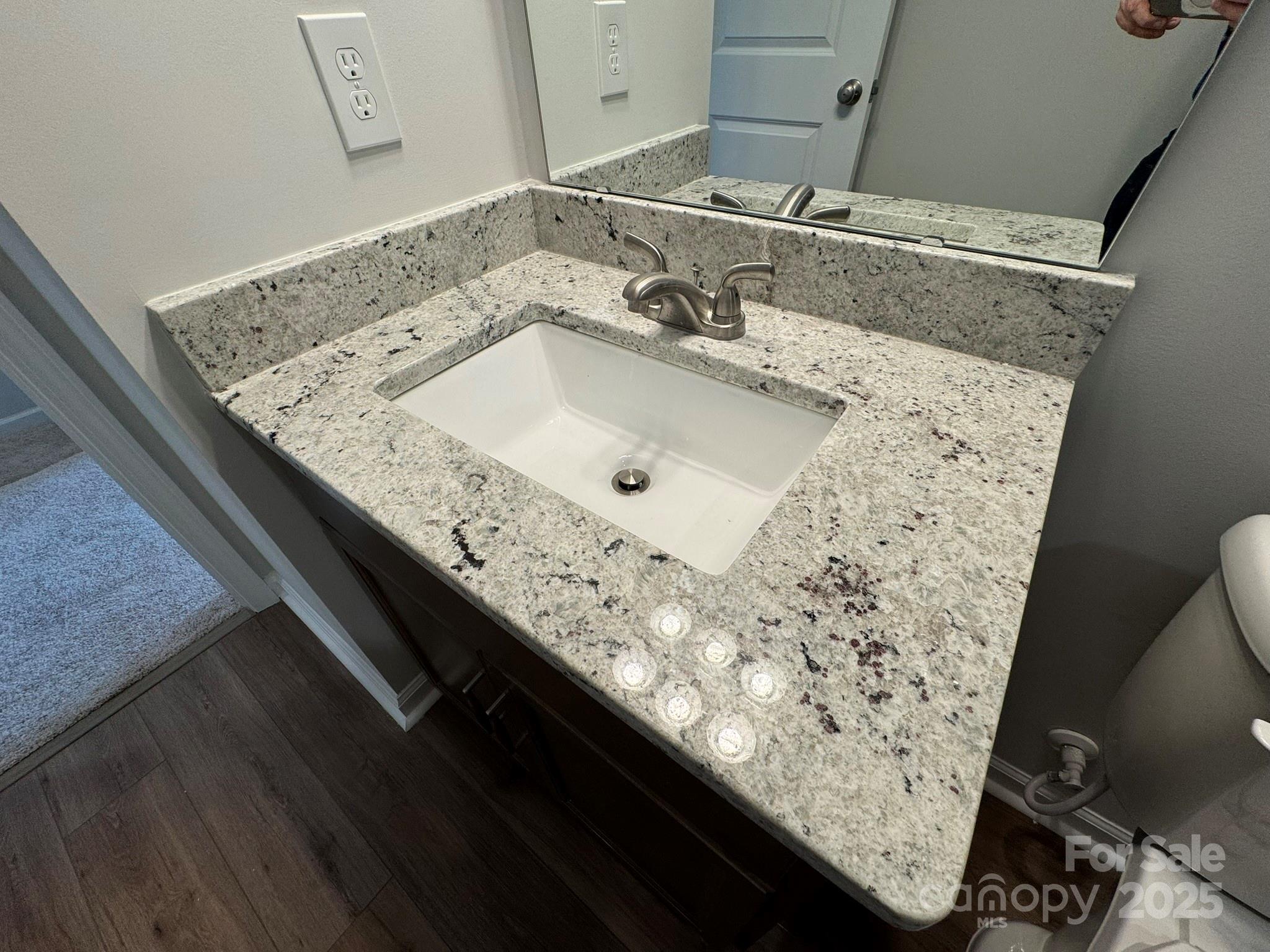 4720 Lakeview Road, Unit 12 Charlotte, NC 28216 - Photo 29 of 41 a bathroom with a granite countertop sink and vanity