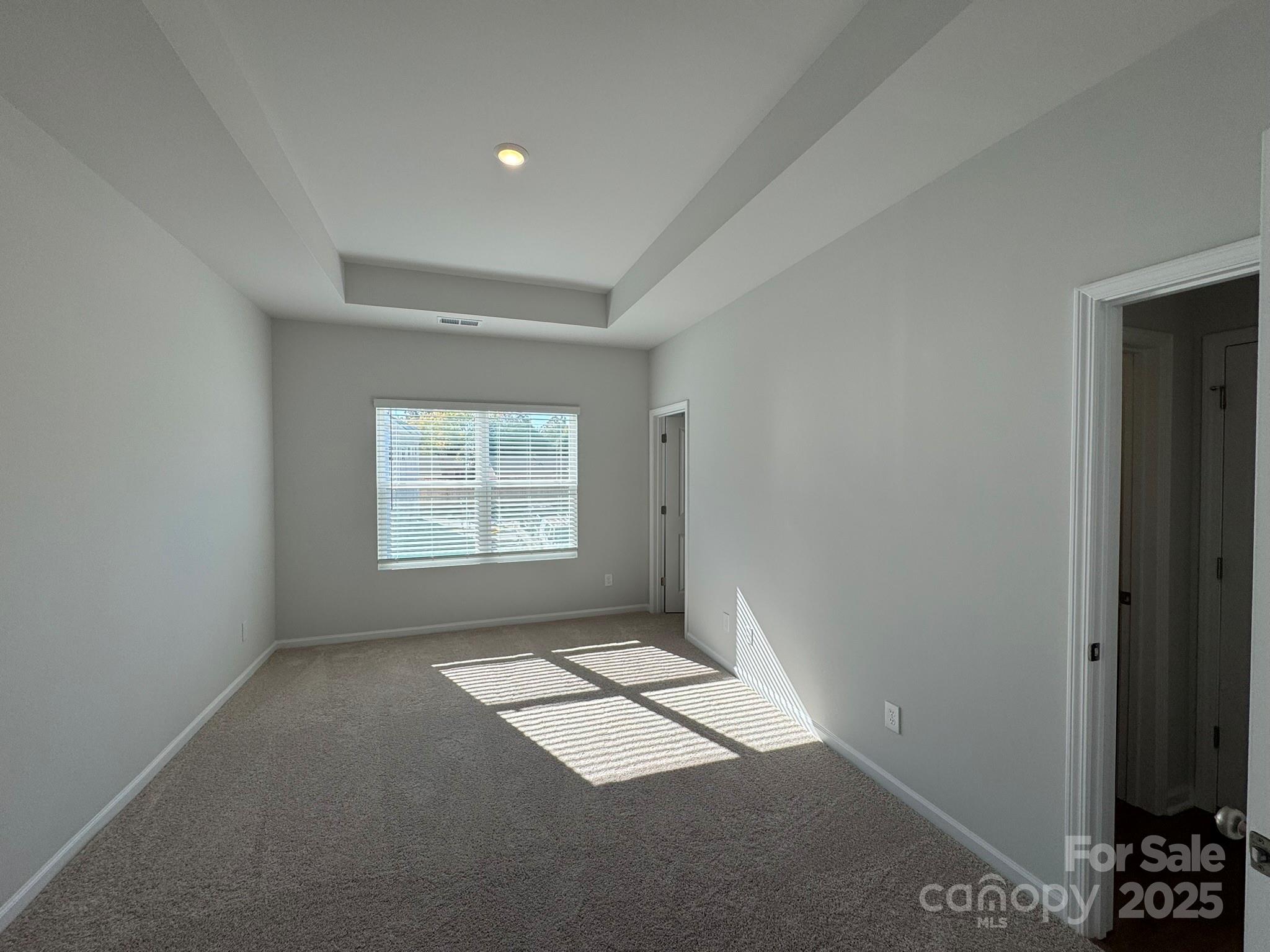 4720 Lakeview Road, Unit 12 Charlotte, NC 28216 - Photo 31 of 41 an empty room with windows