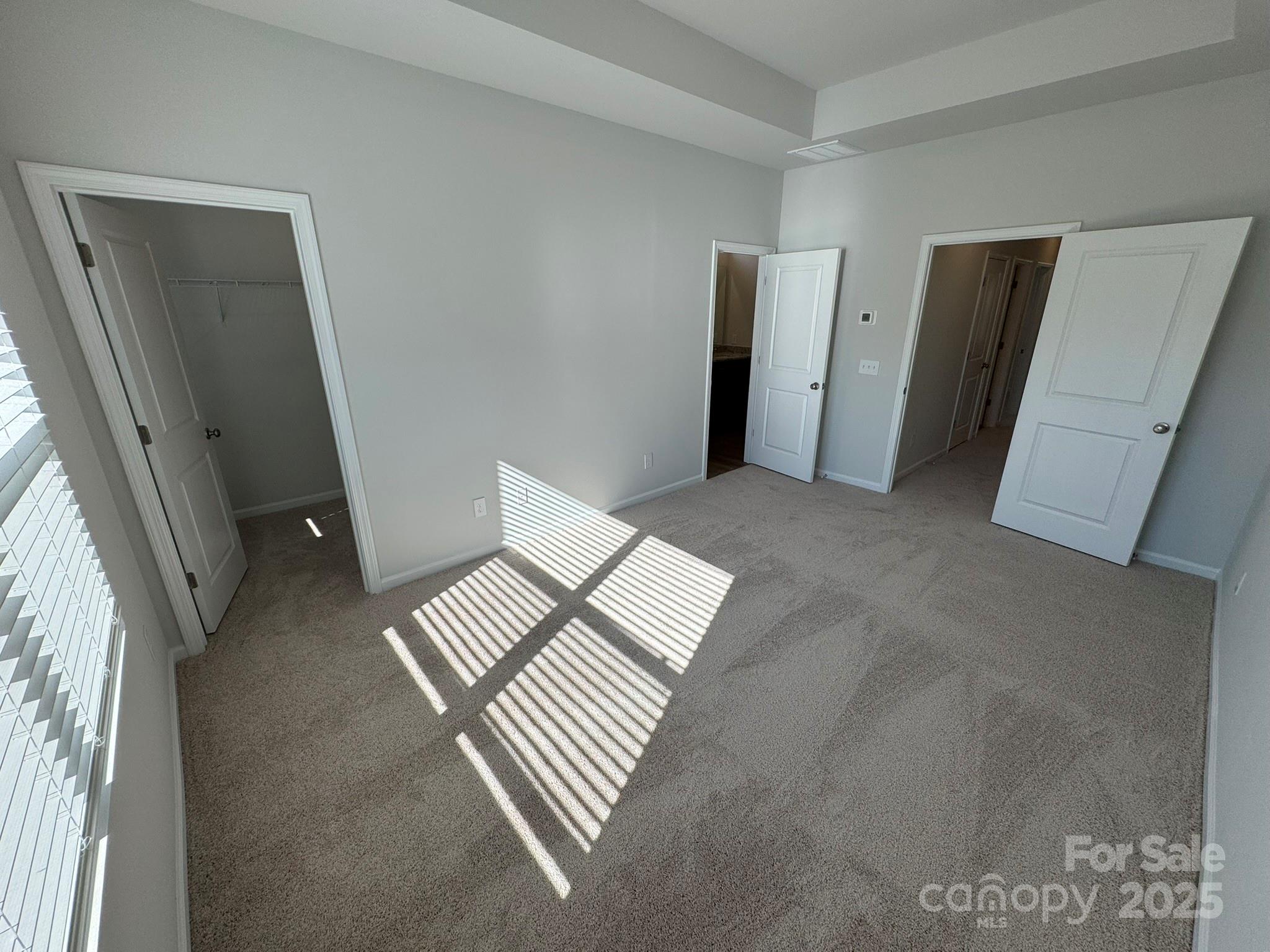 4720 Lakeview Road, Unit 12 Charlotte, NC 28216 - Photo 32 of 41 a view of an empty room with wooden floor and a window