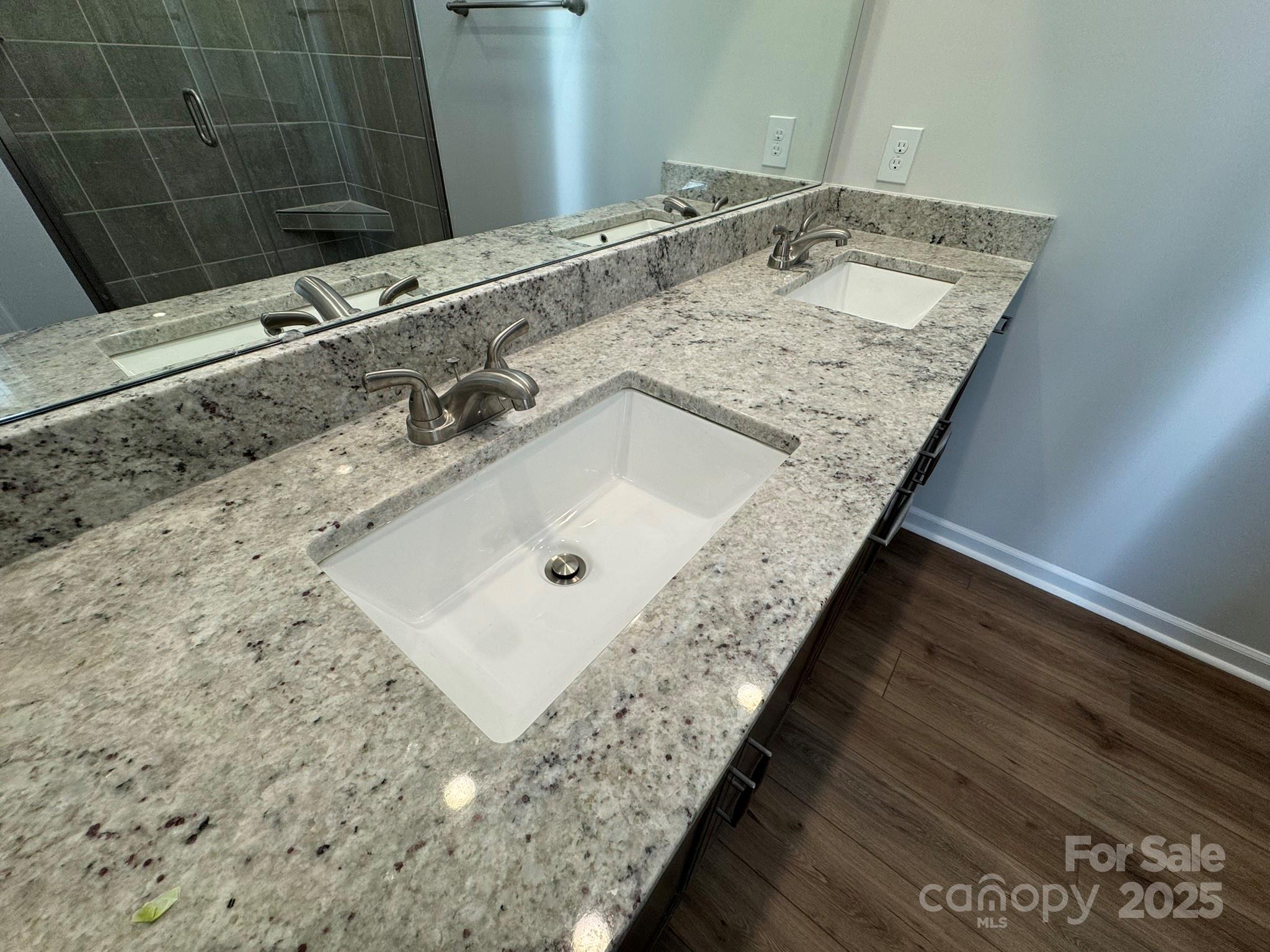4720 Lakeview Road, Unit 12 Charlotte, NC 28216 - Photo 35 of 41 a bathroom with a granite countertop sink and a mirror