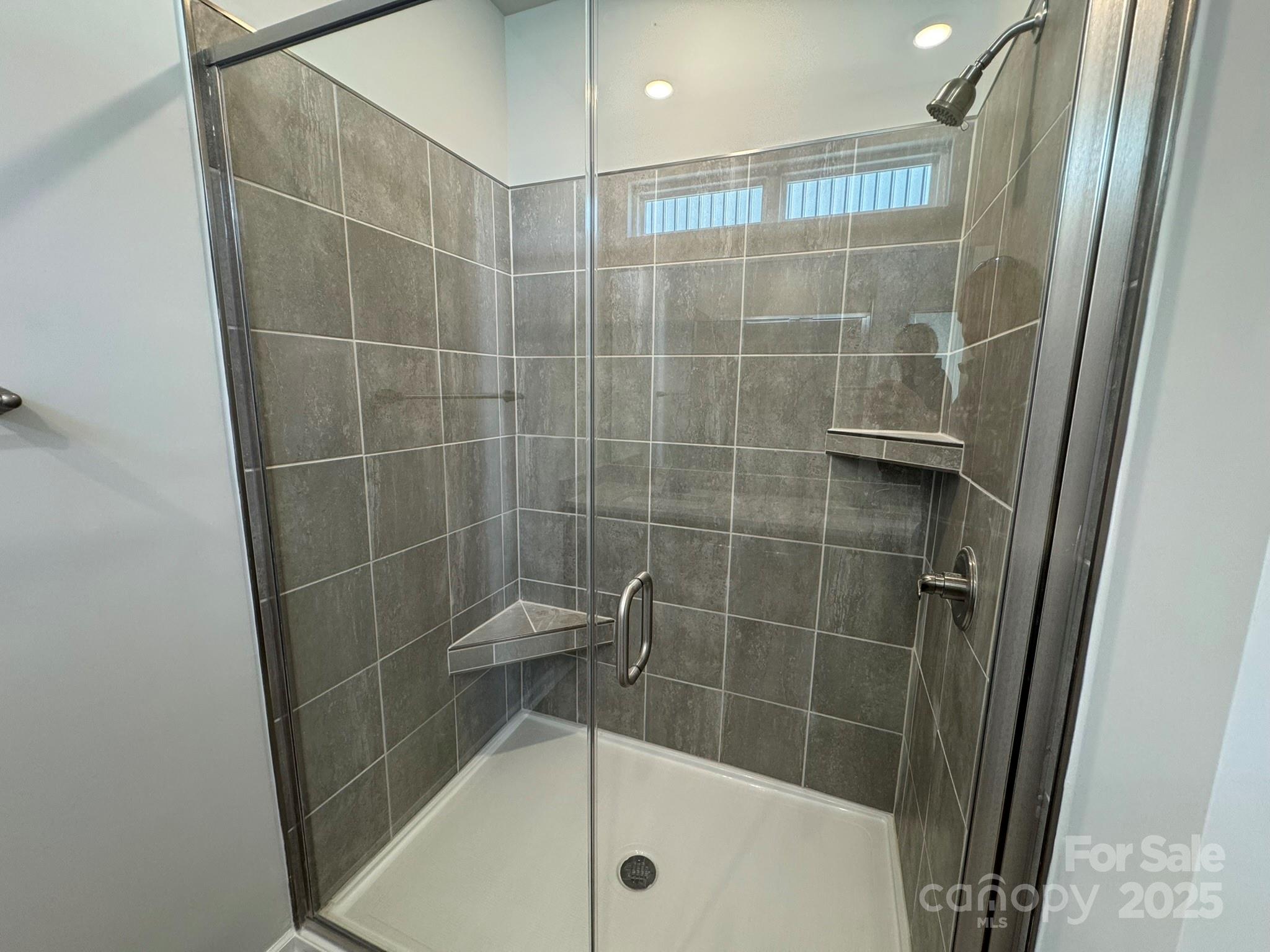 4720 Lakeview Road, Unit 12 Charlotte, NC 28216 - Photo 36 of 41 a bathroom with a shower and a sink