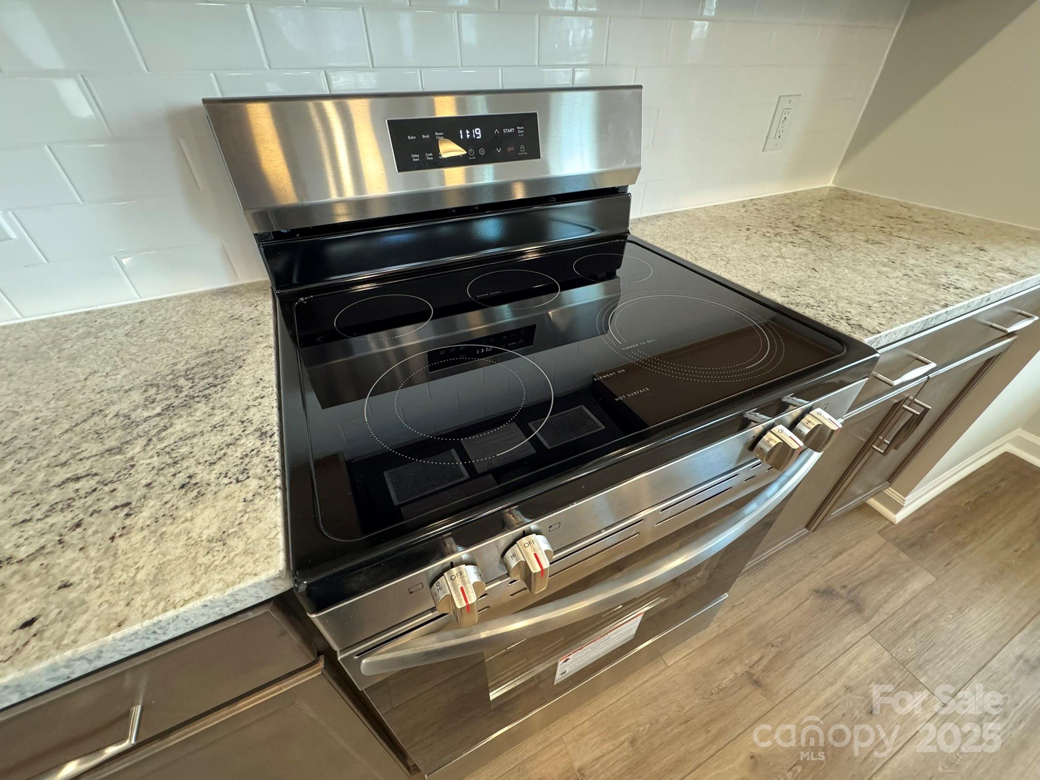4720 Lakeview Road, Unit 12 Charlotte, NC 28216 - Photo 8 of 41 a stove top oven sitting inside of a kitchen