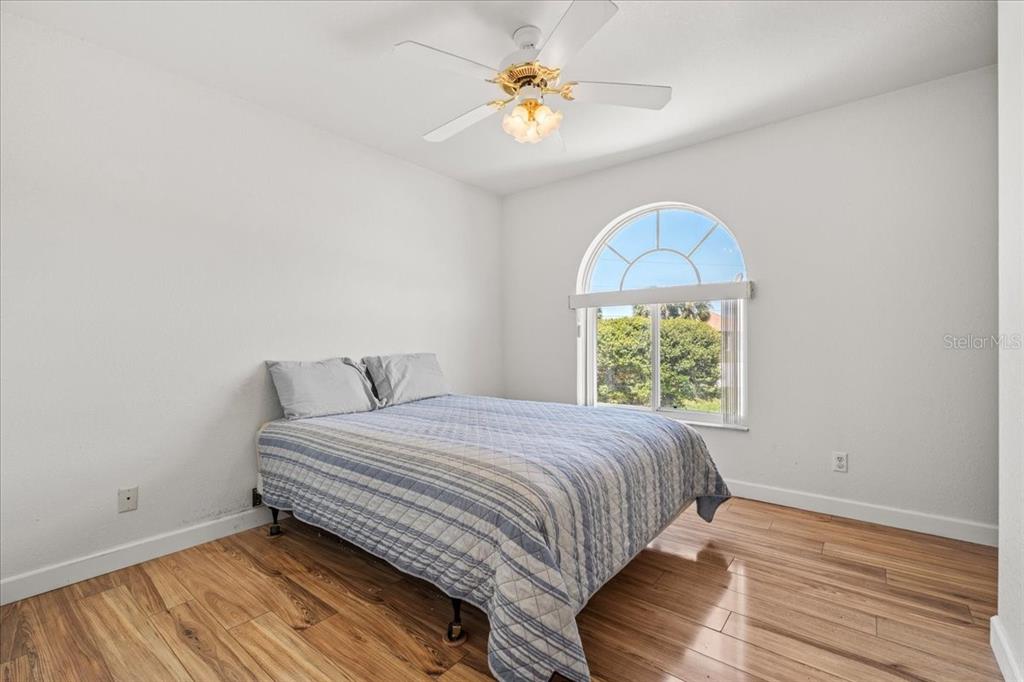 7334 North Tulip Tree Punta Gorda, FL 33955 - Photo 18 of 33 a bedroom with a bed and a window