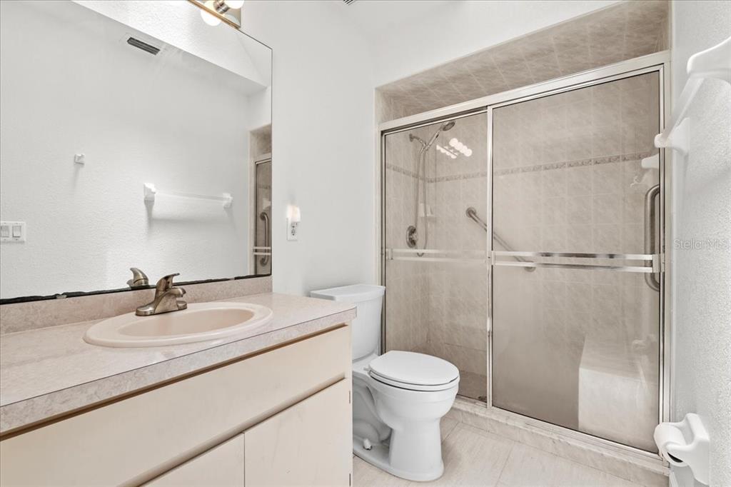 7334 North Tulip Tree Punta Gorda, FL 33955 - Photo 20 of 33 a bathroom with a sink a toilet and shower