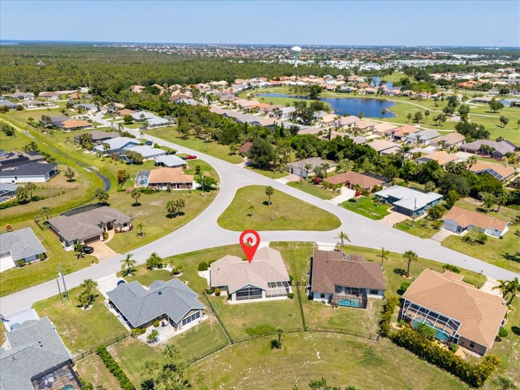7334 North Tulip Tree Punta Gorda, FL 33955 - Photo 29 of 33 an aerial view of residential houses with outdoor space