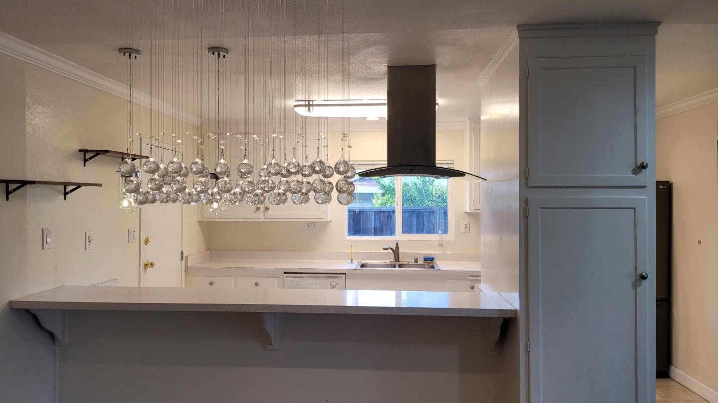 1324 Flicker Way Sunnyvale, CA 94087 - Photo 2 of 16 a bathroom with a sink and a mirror