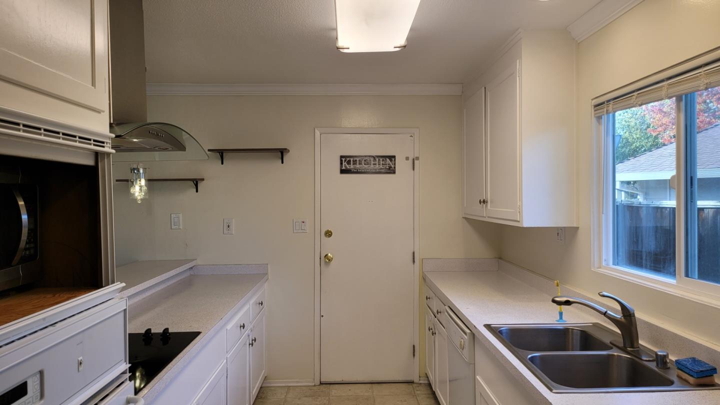 1324 Flicker Way Sunnyvale, CA 94087 - Photo 3 of 16 a kitchen with a sink and a stove top oven