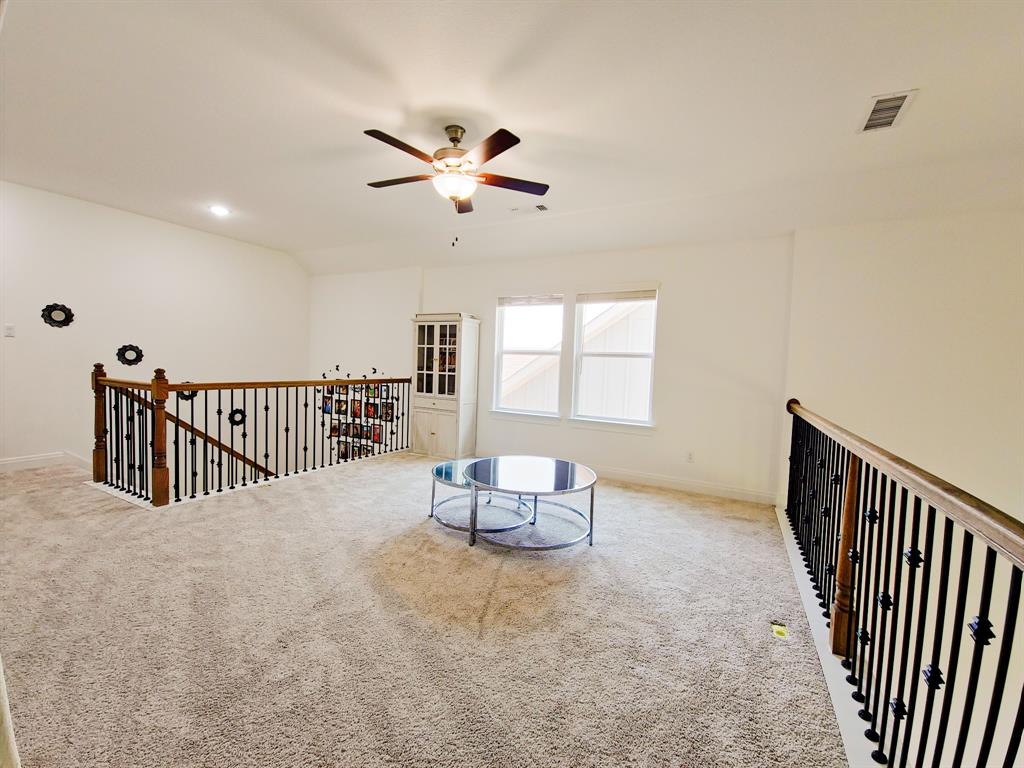 332 Turnbuckle Bend Leander, TX 78641 - Photo 27 of 34 Spacious carpeted loft area featuring a ceiling fan, recessed lighting, and natural light from multiple windows