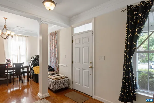 a bedroom with furniture and a large window