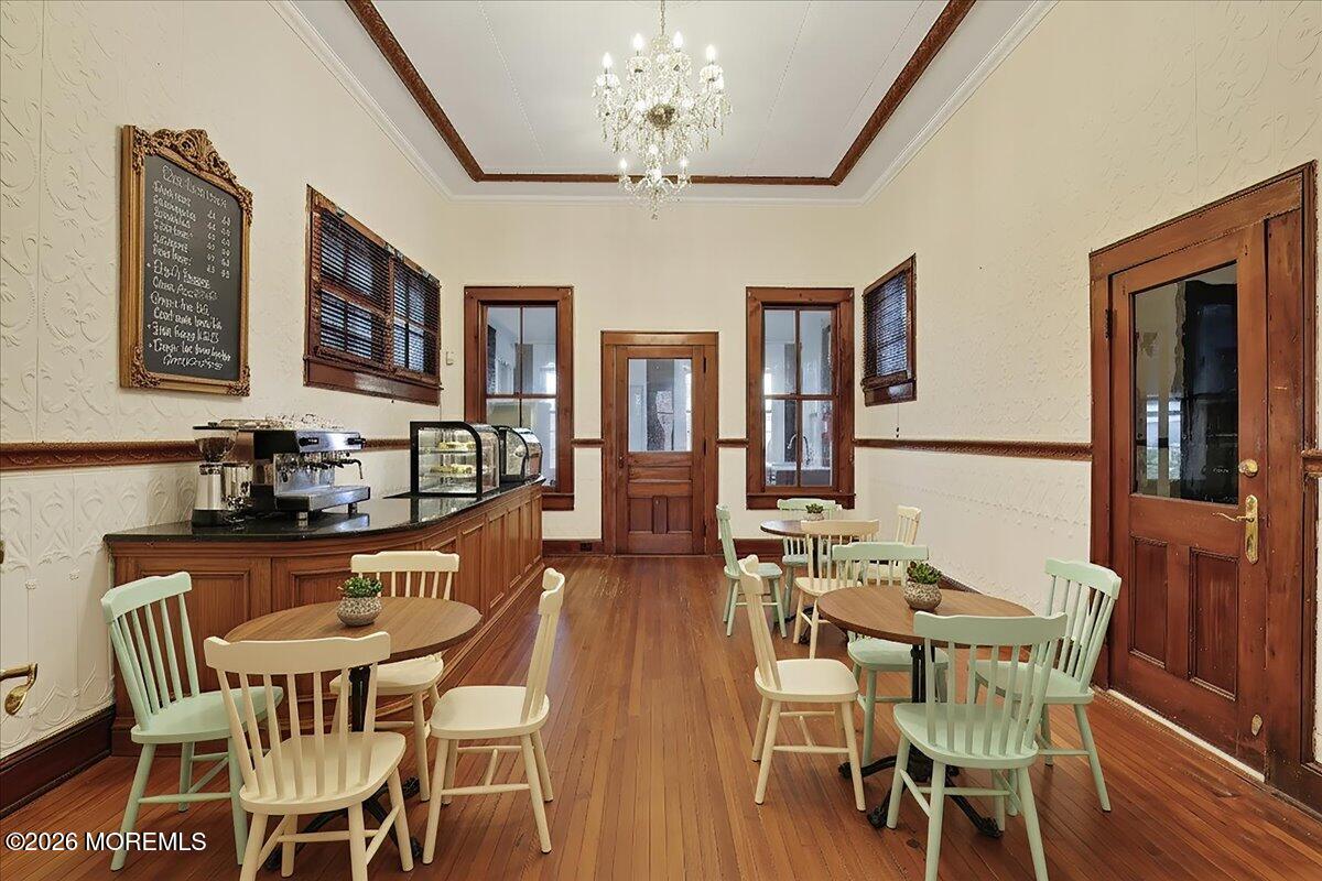 Front Street Keyport, NJ 07735 - Photo 21 of 42 a view of a dining room with furniture a chandelier and wooden floor
