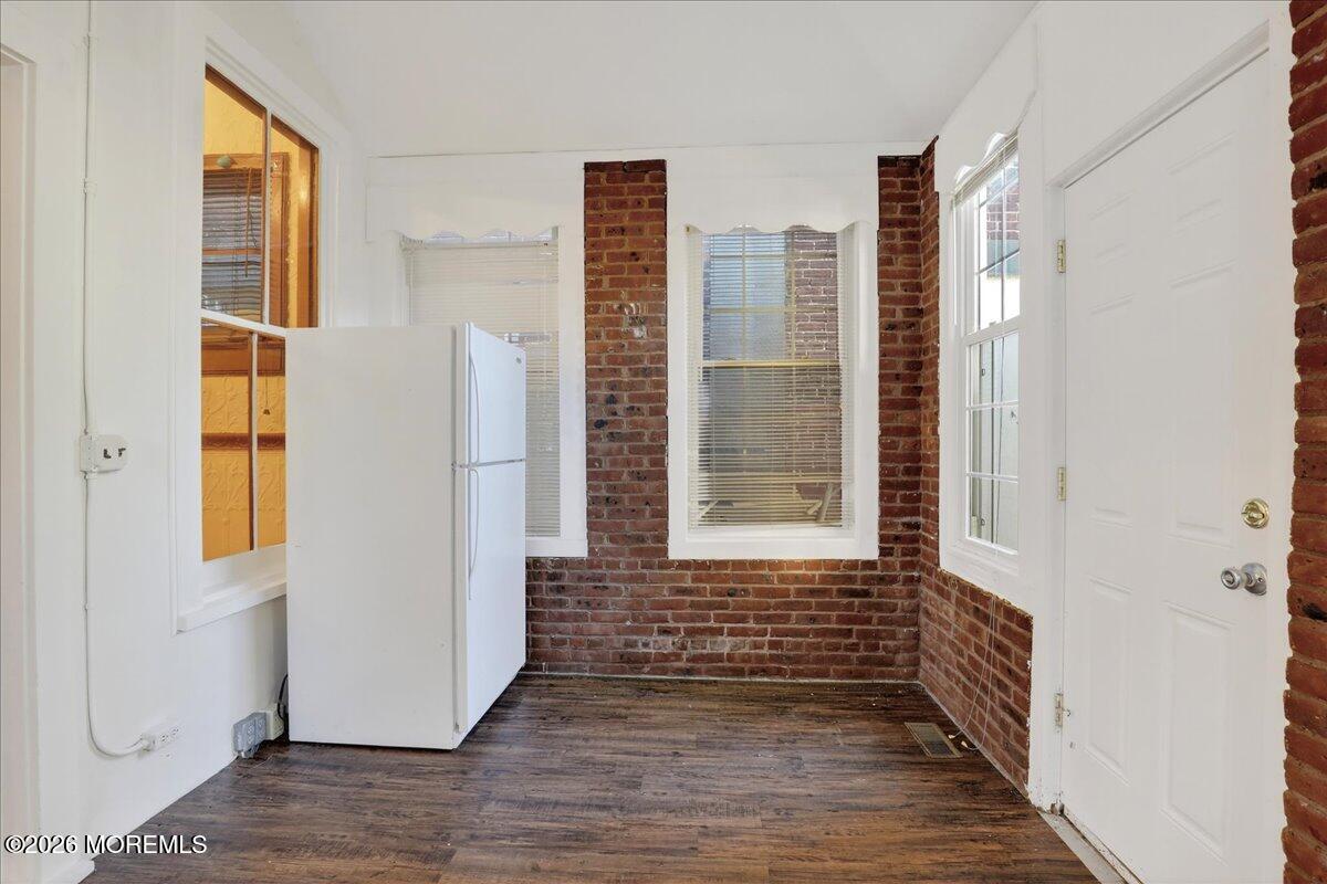 Front Street Keyport, NJ 07735 - Photo 25 of 42 a view of an empty room with a window and wooden floor