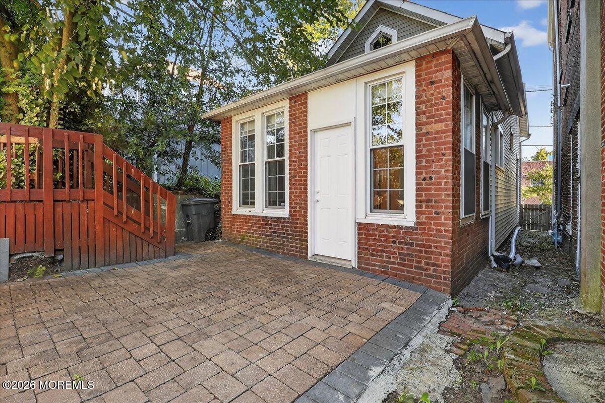 Front Street Keyport, NJ 07735 - Photo 37 of 42 a front view of a house with glass doors