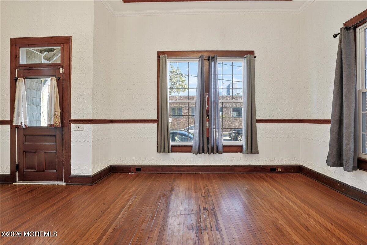 Front Street Keyport, NJ 07735 - Photo 9 of 42 an empty room with wooden floor and windows