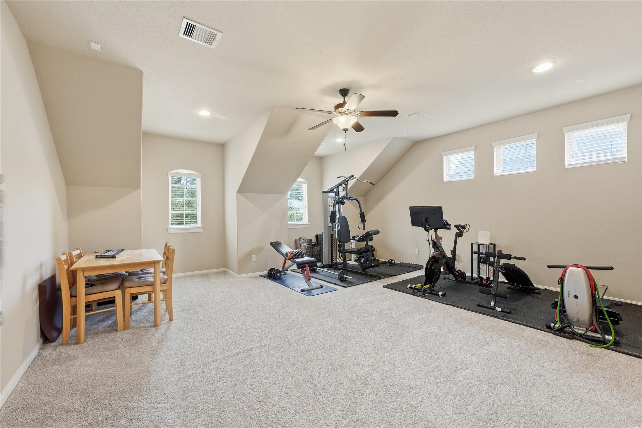 17710 Rough River Court Humble, TX 77346 - Photo 23 of 38 Large game room currently set up as a home gym — endless possibilities for this flexible space!