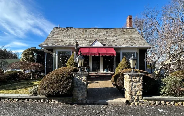 a front view of a house with garden