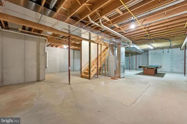 a view of empty room with wooden walls