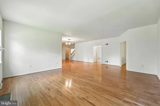 a view of a room with wooden floor