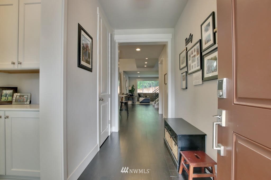 317 Field Place Southeast Renton, WA 98059 - Photo 3 of 29 a view of a hallway to a livingroom with furniture